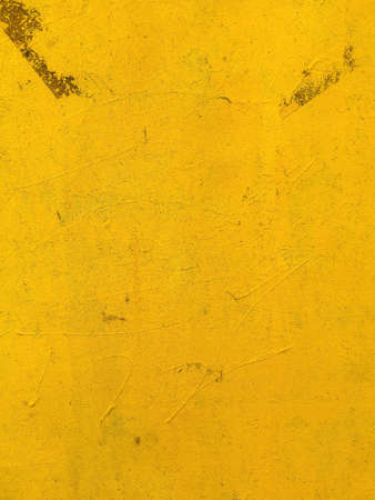 Grunge yellow wall surface as abstract backgroundの写真素材