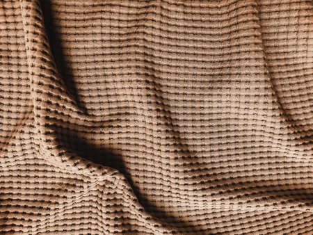 Texture of beige bed cover fabric, close upの写真素材