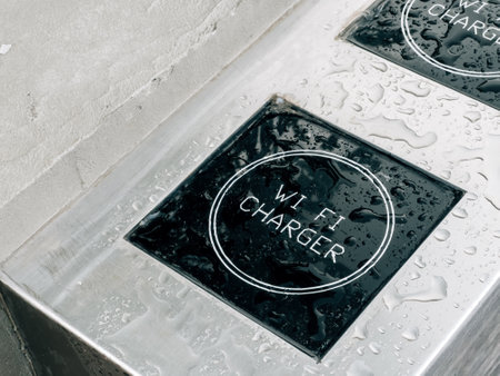 Outdoor street Wi-Fi charger for mobile phones with raindrops, selective focusの写真素材