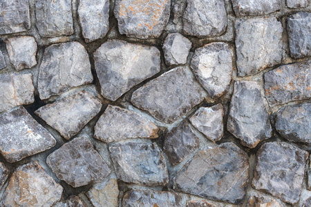 Old stone wall in croatian town of Lovran as backgroundの写真素材