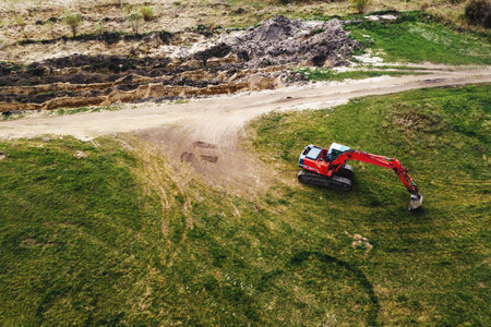 Excavator machinery on archaeological site, aerial shot from drone pov, high angle viewの写真素材
