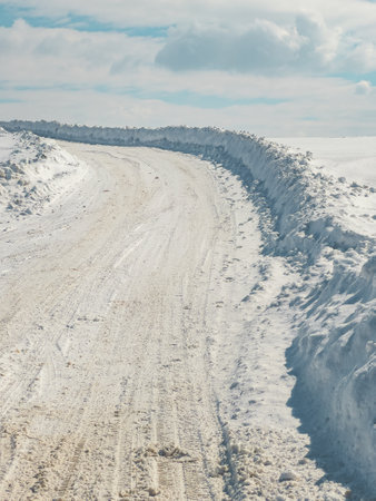 Snow covered road at Zlatibor mountain, empty winter road condition situation, selective focusの写真素材