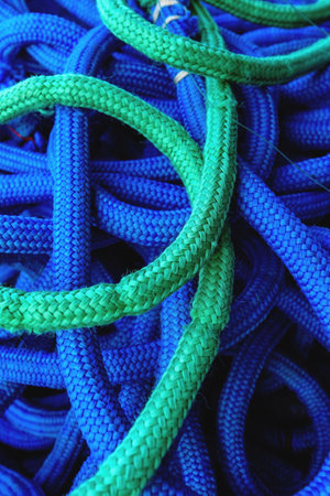 Green and blue commercial fishing rope wire heap, selective focusの写真素材