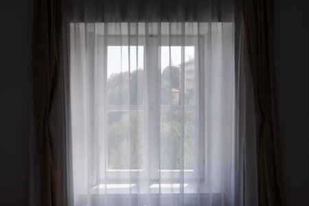 Window shutters and curtains at seaside apartment, selective focus