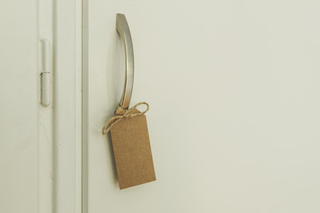 Wardrobe door handle with blank tag as copy space