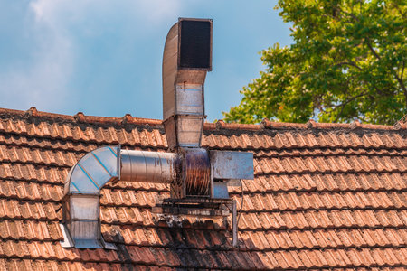 Fast food restaurant chimney extractor on the roof, selective focusの写真素材