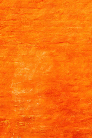 Orange brick wall facade as background. Old building exterior wall surface from Halmstad in Sweden.の写真素材