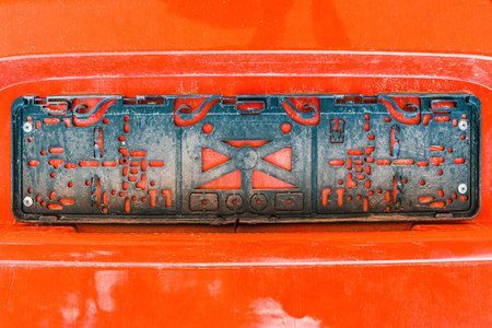 Car plastic license plate holder, old worn and dirtyの写真素材