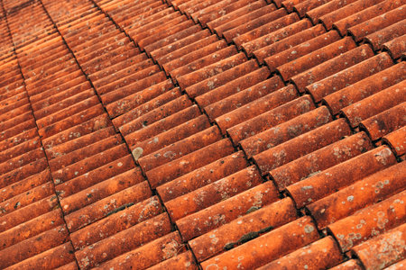 Old rustic terracotta roof tiles pattern as background, architectural detail from Lovran, Croatia
