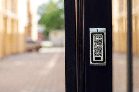 Numeric keypad door lock at building entrance, selective focusの写真素材