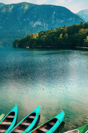 Canoe boats at Lake Bohinj in Slovenia in summer morningの写真素材