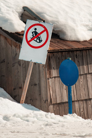 Sledging is forbidden sign in ski resort in winterの写真素材