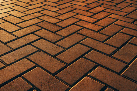 Paving bricks in diminishing perspective as abstract background, selective focusの写真素材