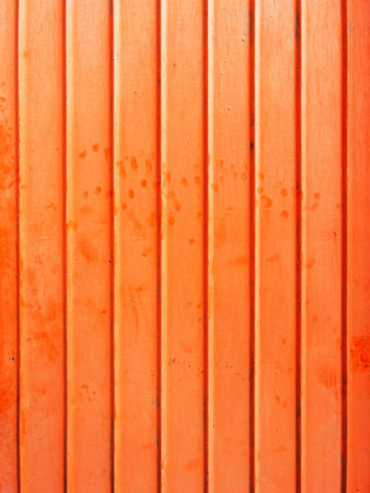 Orange metallic surface as design element background and textureの写真素材
