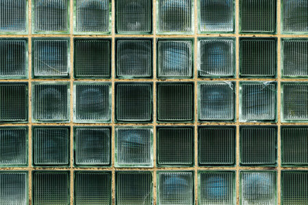 Old solid glass block brick wall pattern as backgroundの写真素材