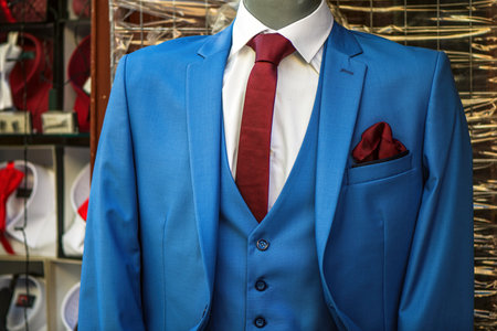 Elegant blue business suit on mannequin in front of the clothing store, selective focusの写真素材
