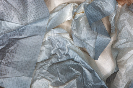Crumpled gift wrapping packing paper as texture, top viewの写真素材