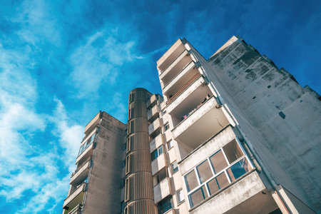 Residential skyscraper building from 1980s as fine example of brutalist architecture style, low angle viewの写真素材