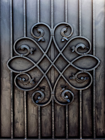 Wrought iron decoration on entrance gate, vertical image