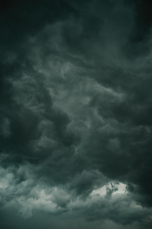 Ominous dark supercell stormy clouds in summer, vertical imageの写真素材