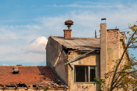 Old ruin, devastated house with roof tile ready to be rundown, selective focusの写真素材
