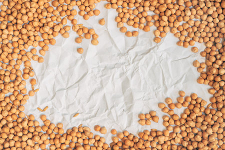 Top view of chickpea on crumpled white paper as backgroundの写真素材