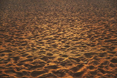 Texture of brown sand on the beach, selective focus