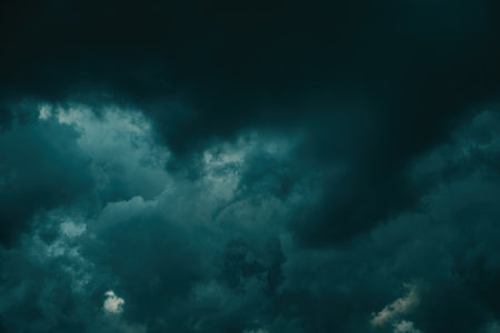 Dark supercell stormy clouds in summer, low angle viewの写真素材