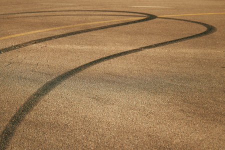 Bike skid marks, tire track tread burnout marking on asphalt road, selective focusの写真素材