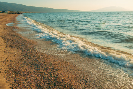 Vrasna beach, beautiful seaside landscape with sea waves splashing the sandy shoreline, selective focusの写真素材