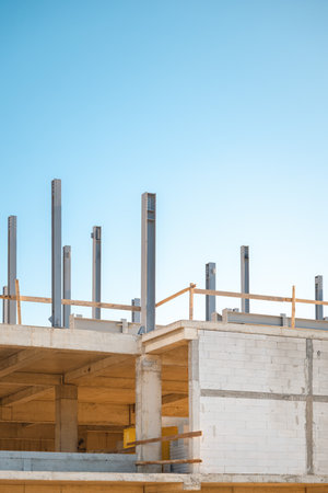 Steel posts and beams at building construction site, selective focusの写真素材