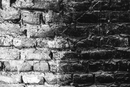 Old brick wall in black and white, grunge texture and pattern as backgroundの写真素材
