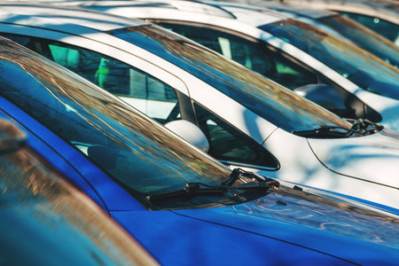 Cars on parking lot on a sunny day, selective focus