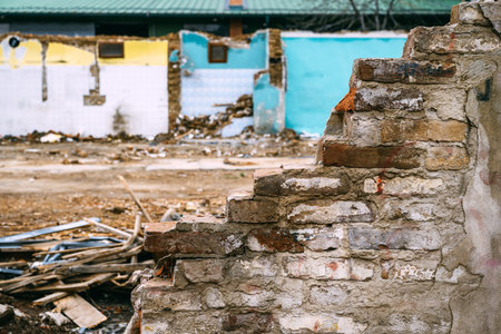 House demolition site, remains of an old brick wall of a run down building, selective focusの写真素材
