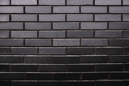 Black brick wall pattern. Brickwall surface background as design element.の写真素材