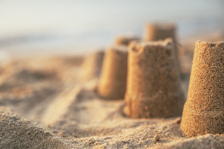 Sand castle at the seaside beach, selective focusの写真素材