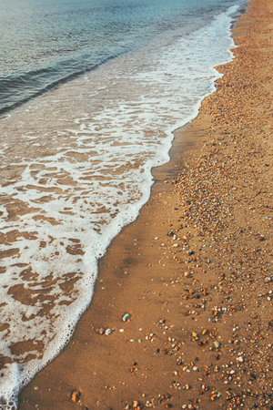 Vrasna beach, beautiful seaside landscape with sea waves splashing the sandy shoreline, selective...