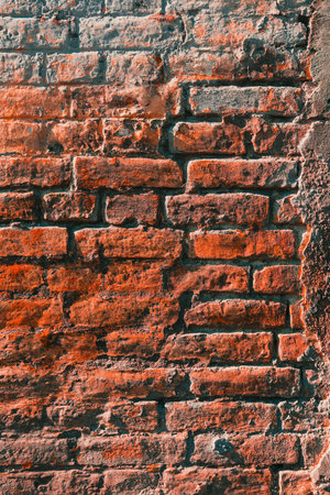 Texture of an old worn brick wall as background, vertical imageの写真素材