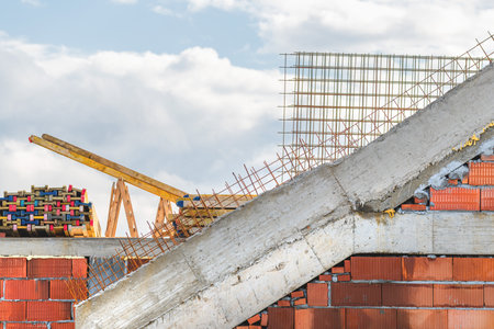 Residential building construction site, concrete structure with block steel mash and planks, selective focusの写真素材