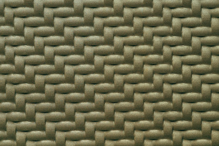 Woven pattern metallic plate surface as design background and textureの写真素材