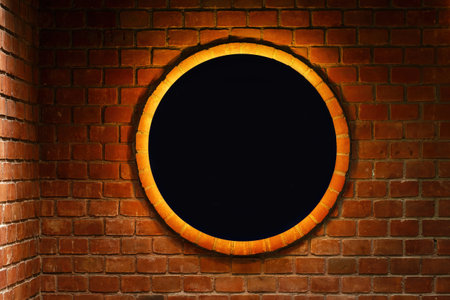 Illuminated black circle mockup copy space on a brick wall as background