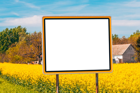 Empty sign mockup in cultivated rapeseed field, selective focusの写真素材