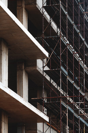 Reinforced concrete form structural building construction site with scaffolding, selective focus