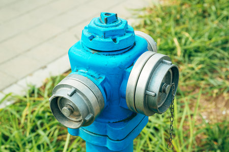 Blue water hydrant with B and C type coupling for fire hose, selective focus