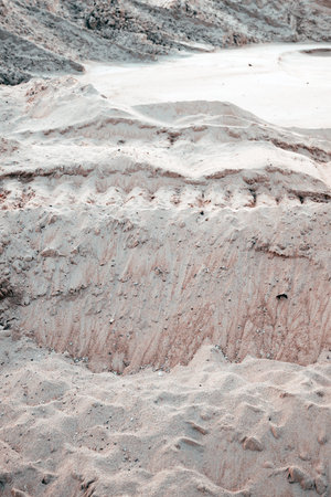 Detailed view of wavy sand surface showing fine grains, wind marks, and natural desert textures. Selective focus.の写真素材