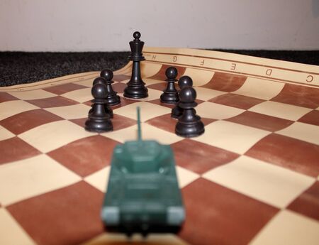 Tank attacking black chess kingの写真素材