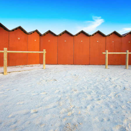 A series of bathing huts on a white beach in Tuscany  Bathing huts are also known as a beach cabins or bathing boxes の写真素材