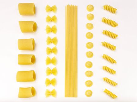 Italian pasta series  Paccheri, farfalle, spaghetti, orecchiette and fusilli on a white tablecloth の写真素材