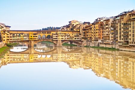 Ponte Vecchio, old bridge, medieval landmark on Arno river and its reflection  Long exposure photography  Florence, Tuscany, Italy の写真素材