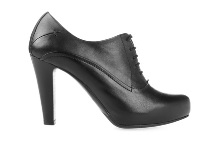 High heel pump black shiny leather women shoe  Side view on white background with light shadowの写真素材